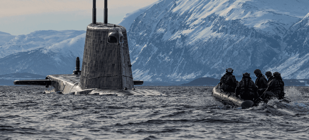 People approaching a submarine in a boat