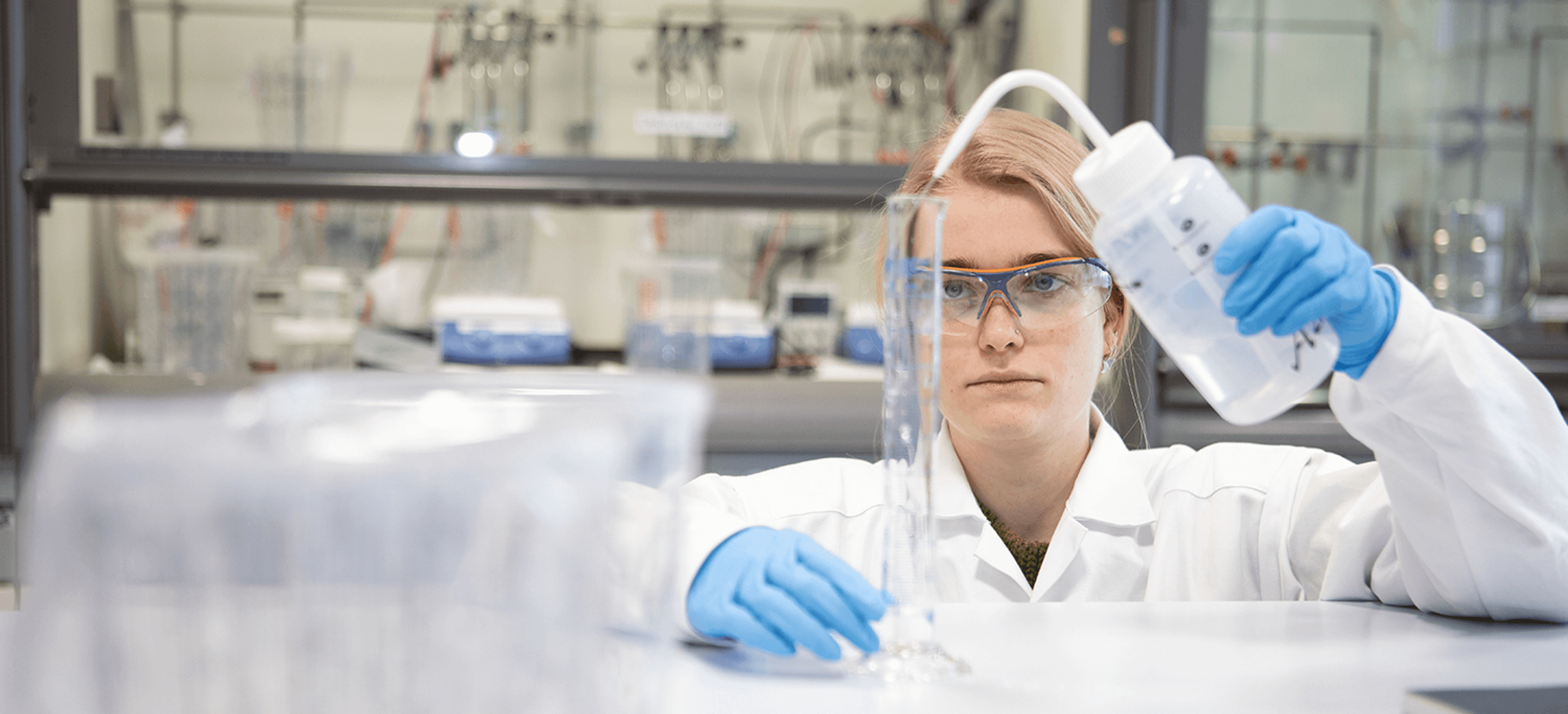 A female scientist working in a lab A female scientist working in a lab